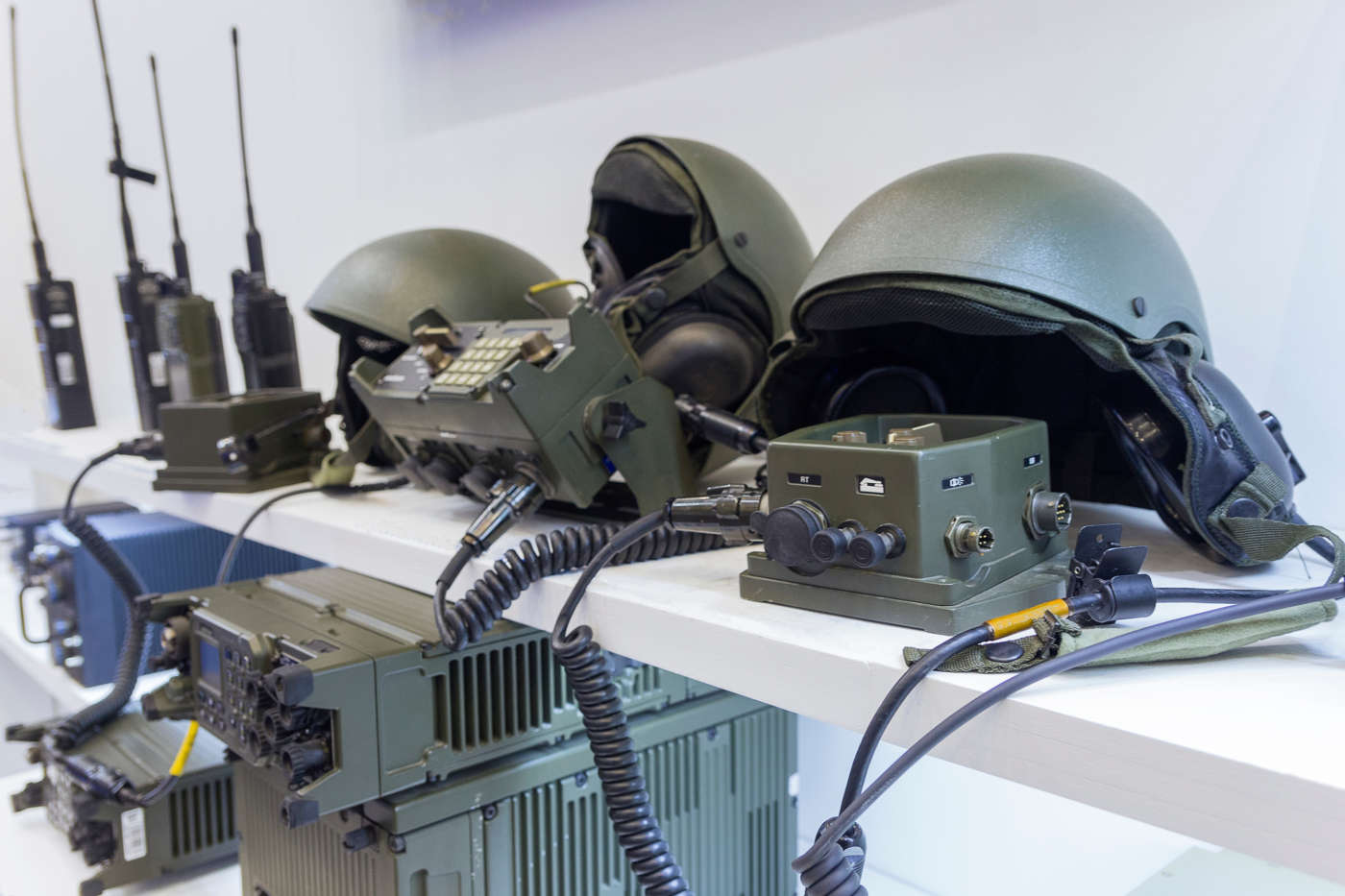 Military helmet and electronics at the exhibition. Weapons